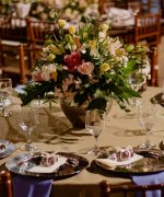 A table set for a wedding reception with flowers