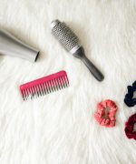 Grey Hair Blower Near Pink Hair Combs and Scrunchies