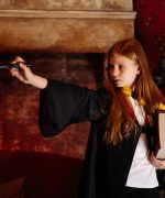 A Girl Practicing Her Wizard Skill with a Magic Wand