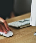 Person Holding Apple Magic Mouse