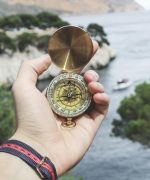 Person Holding Compass