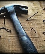 Black Claw Hammer on Brown Wooden Plank